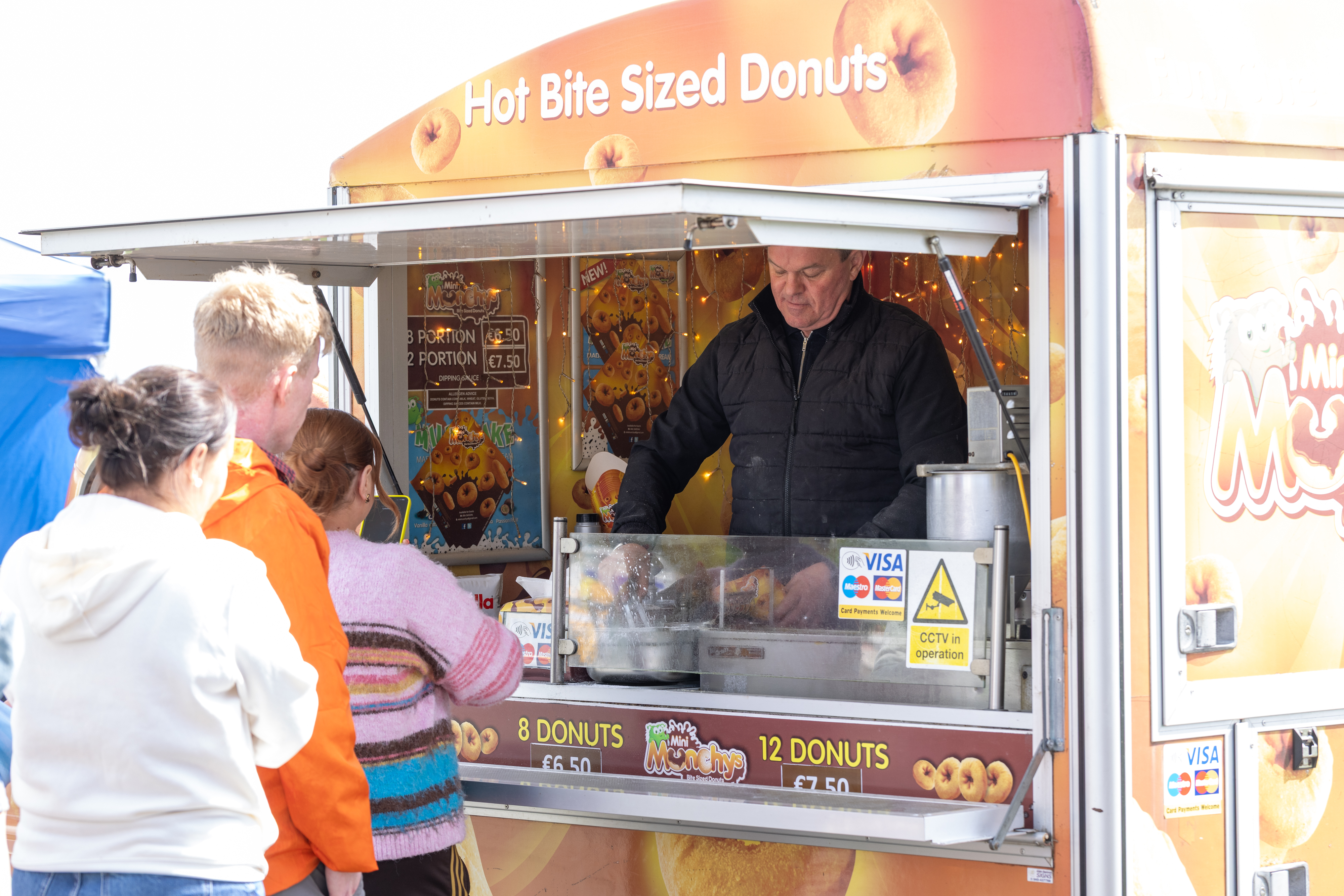 Donut stall with queue. 